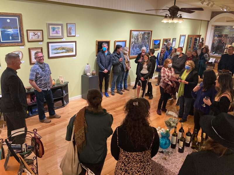 Image of people gathered at an art gallery art opening